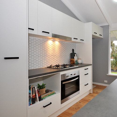 Kitchen design including cabinetry, benchtop, tapware, appliances, lighting design and selections